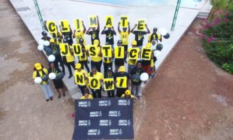 Action Symbolique à l’AGE 2025 : Amnesty Burkina réaffirme son engagement pour la Justice Climatique